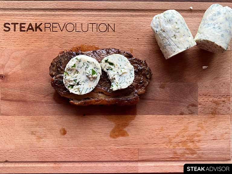 Compound steak butter on freshly cooked steak