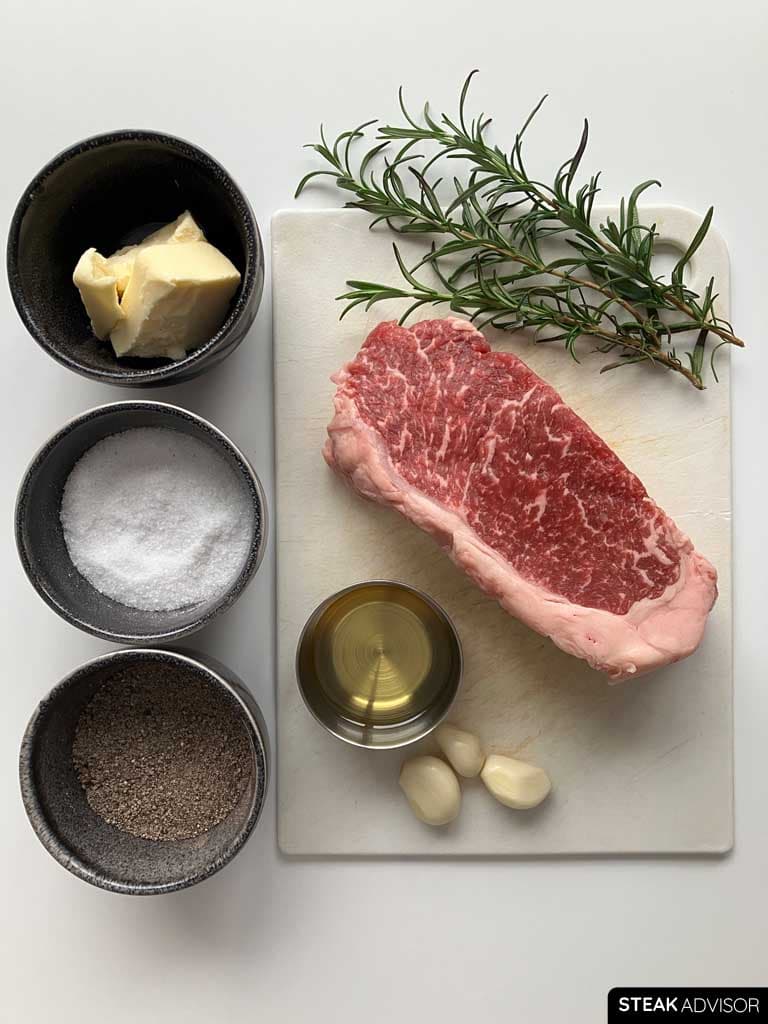 Ingredients: black pepper, garlic cloves, salt, butter, refined avocado oil, thyme sprigs, and steak.