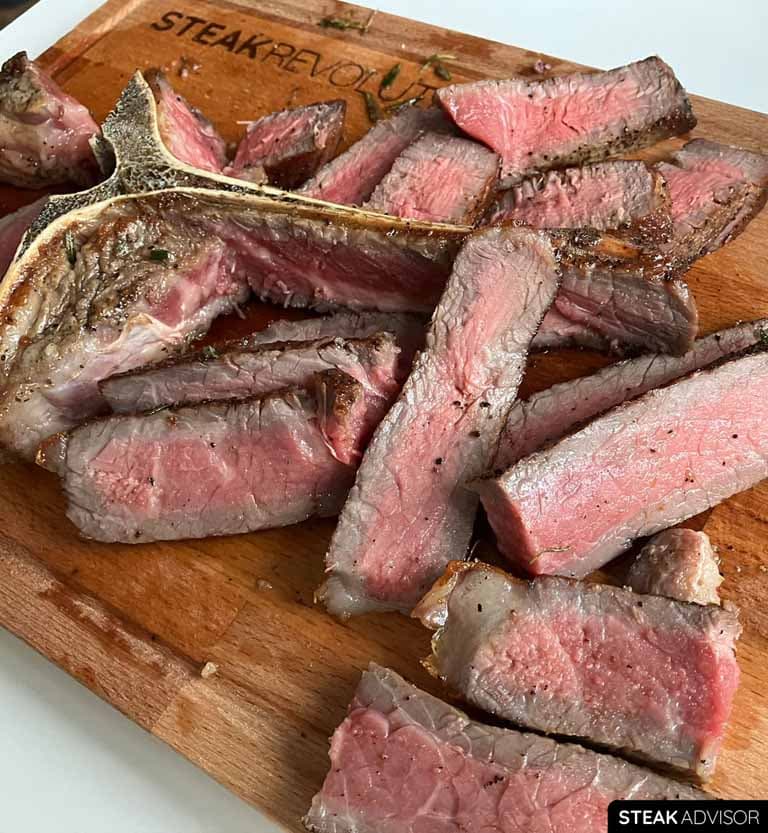 pan-seared porterhouse steak; medium-rare doneness, vertical view