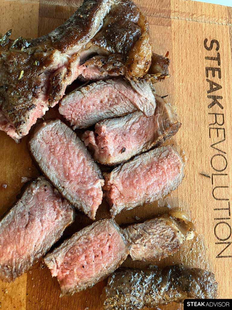 pan seared bonein ribeye steak medium rare doneness vertical view