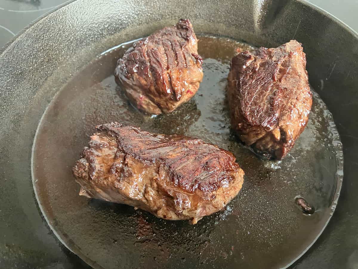 Searing Hanger Steak Pieces in a Cast-Iron Skillet