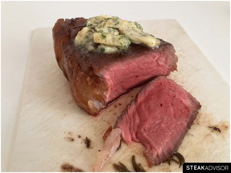 Perfectly cooked steak topped with compound butter