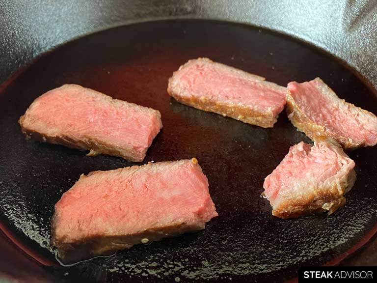 Reheating steak slices in a pan