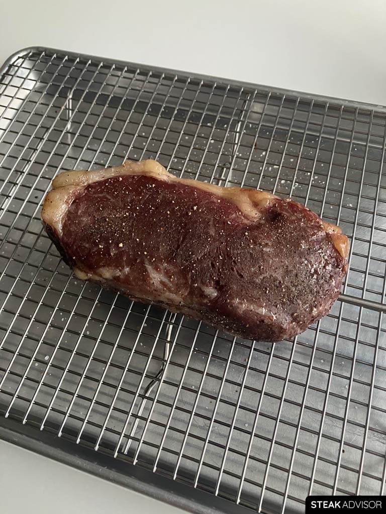 Steak cooked low and slow in the oven using the reverse-sear method, ready for the final sear.