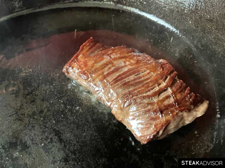 steak seared in a cast-iron skillet for a rich, flavorful crust.