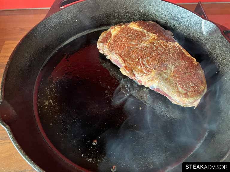 Seared steak in a cast iron skillet