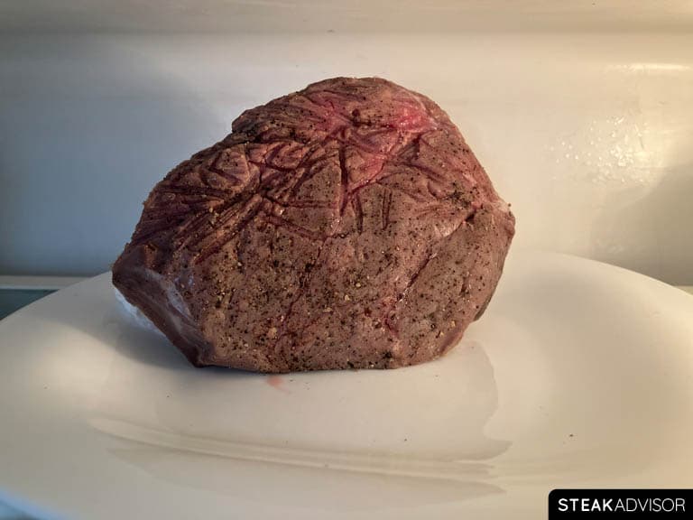 Sous vide steak chilling in the refrigerator before searing.