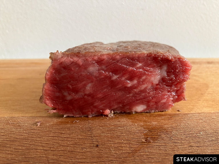 Steak cooked to blue rare doneness at 115°F or 46°C