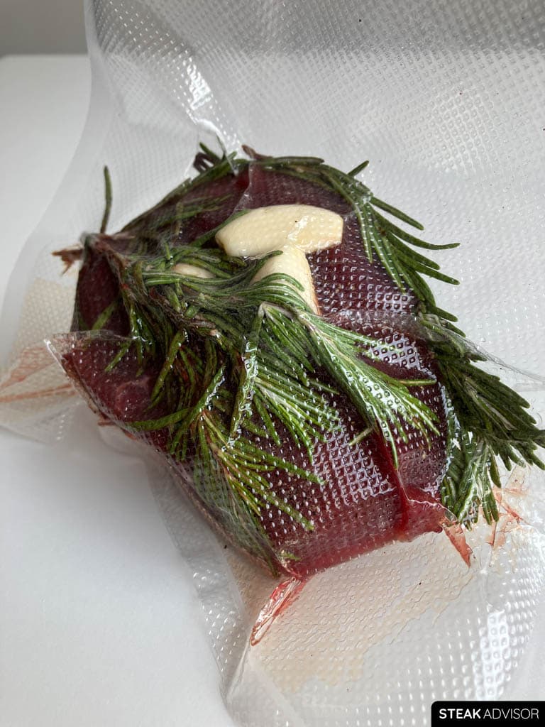A steak sealed in a bag, ready for sous vide cooking.