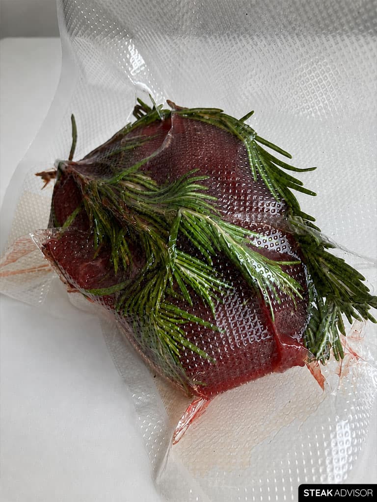 A steak sealed in a bag, ready for sous vide cooking.