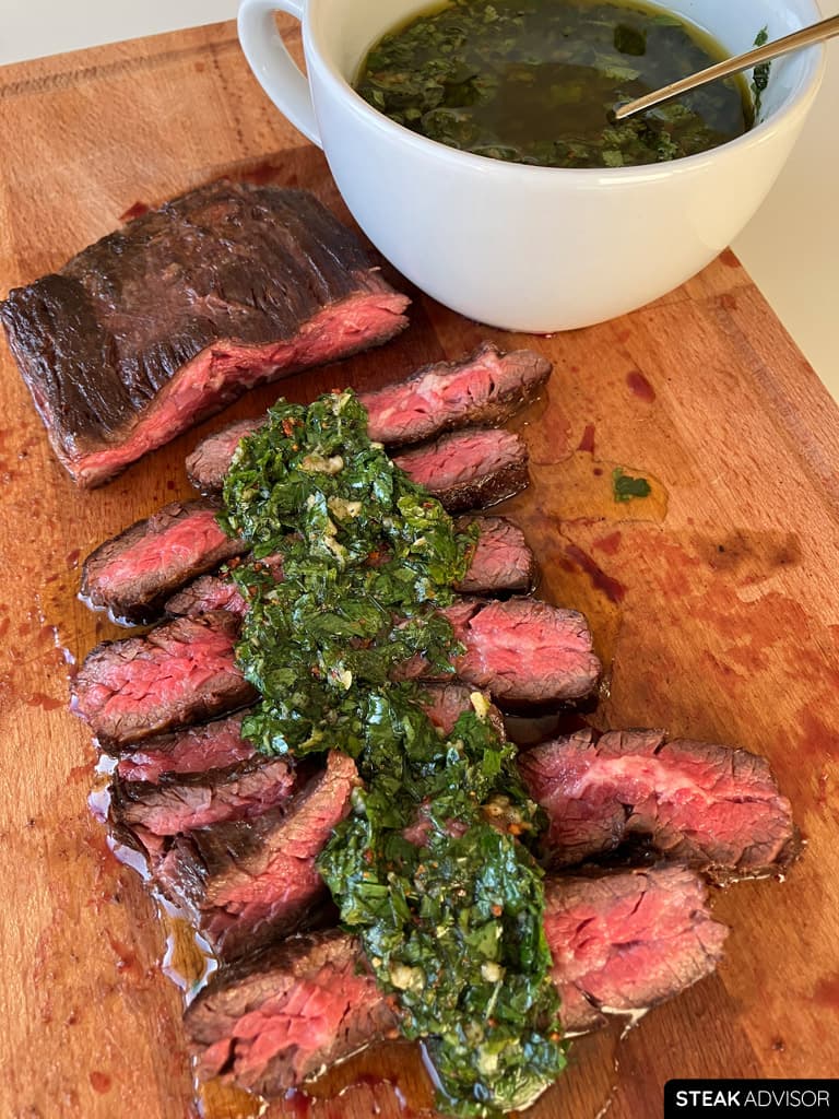 Steak served with chimichurri sauce.