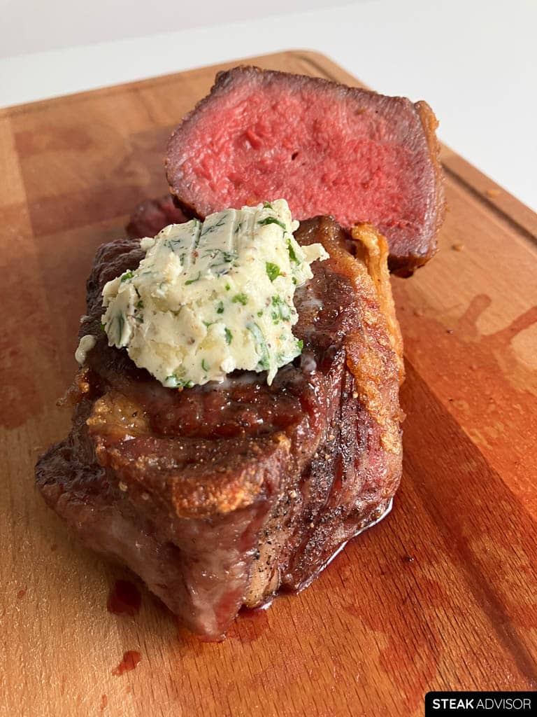 Steak topped with garlic herb compound butter