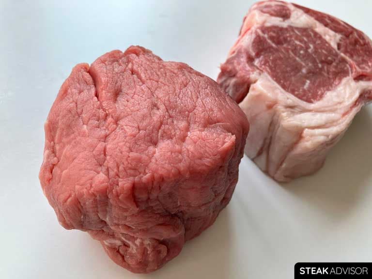 The most tender steak, filet mignon, is on the left, while the less tender ribeye is on the right