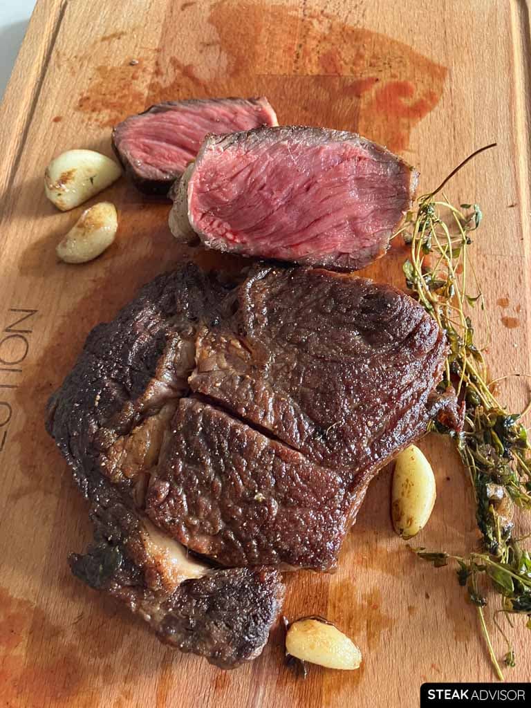 Vertical photo of a sliced cast iron seared steak