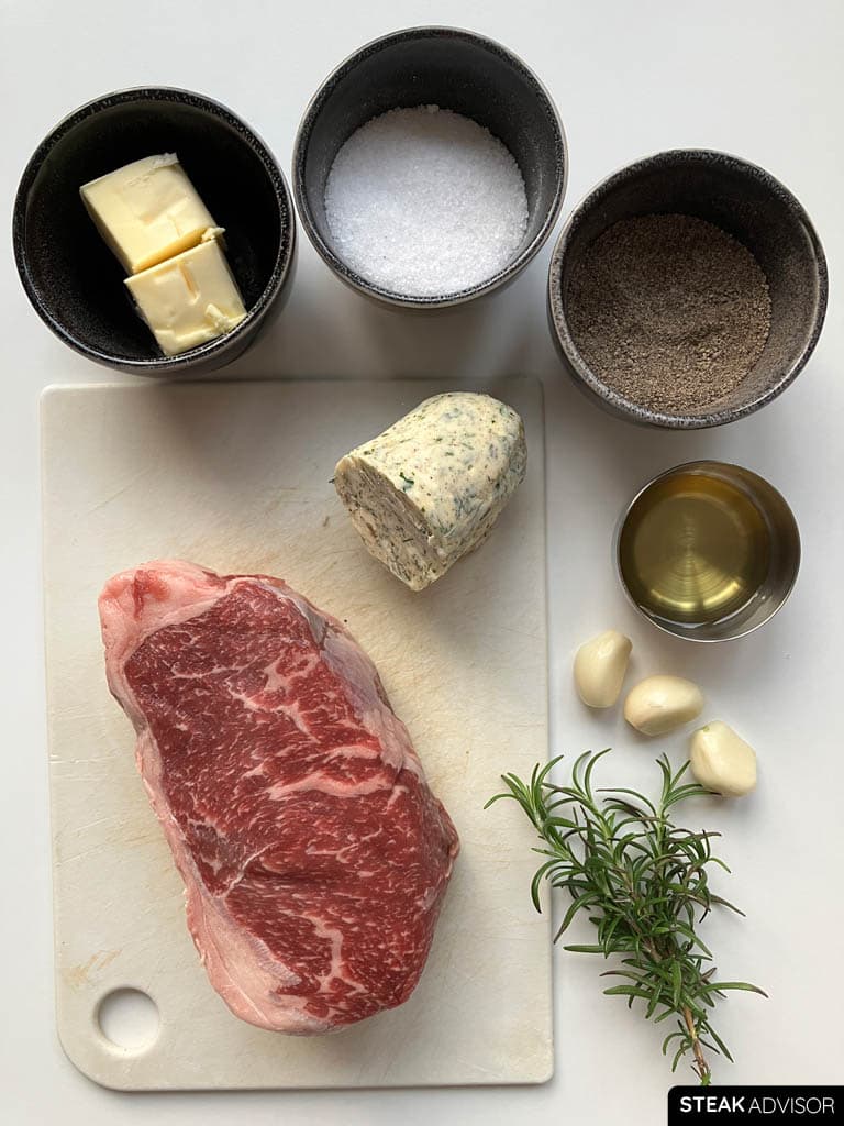 Ingredients: black pepper, garlic cloves, salt, butter, refined avocado oil, compound butter, rosemary, and steak.