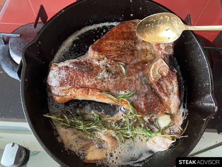 baste the porterhouse steak with the melted butter