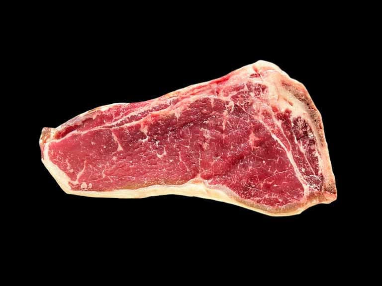 raw bone-in strip steak