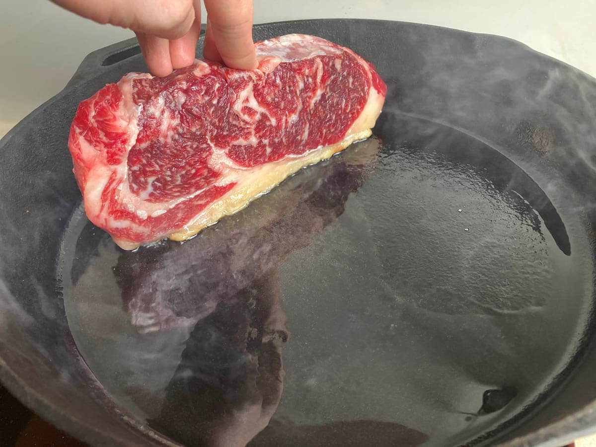 Guide to cooking steak in a cast-iron skillet.