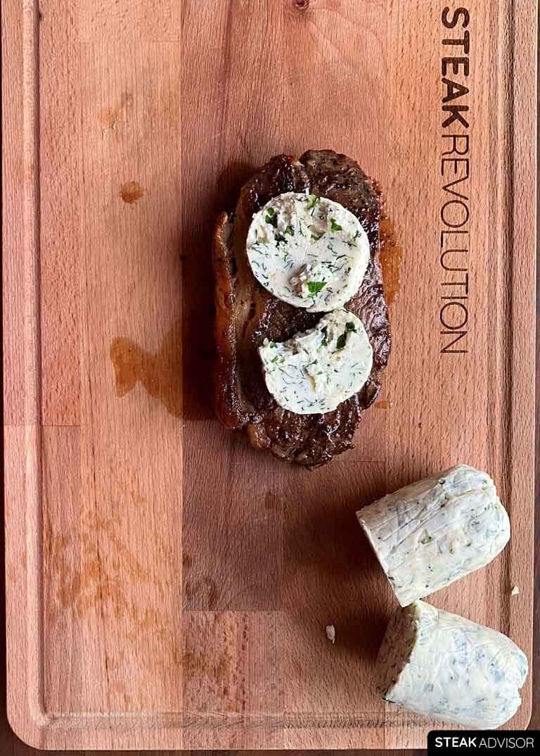compound steak butter coins on a cooked steak