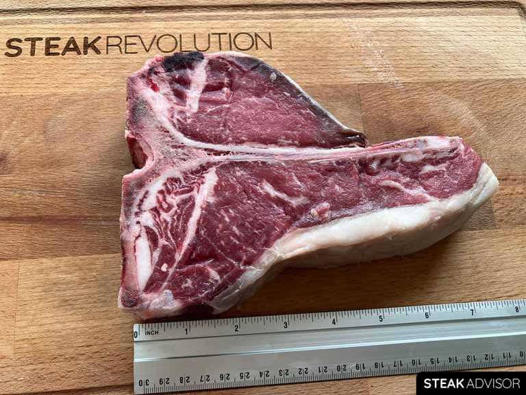 1.5 lbs Porterhouse Steak, approximately 8 inches long.