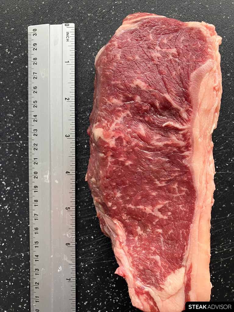 The length of a strip steak averages around 8 inches