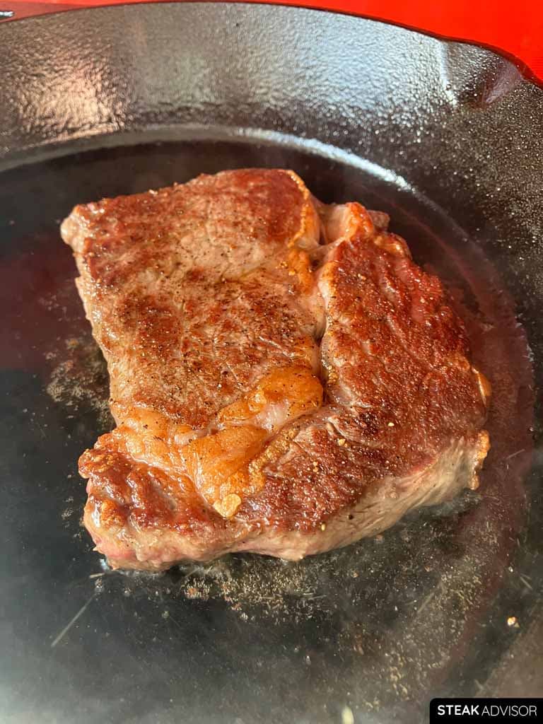 Ribeye steak pan-seared to a rich, golden-brown finish.