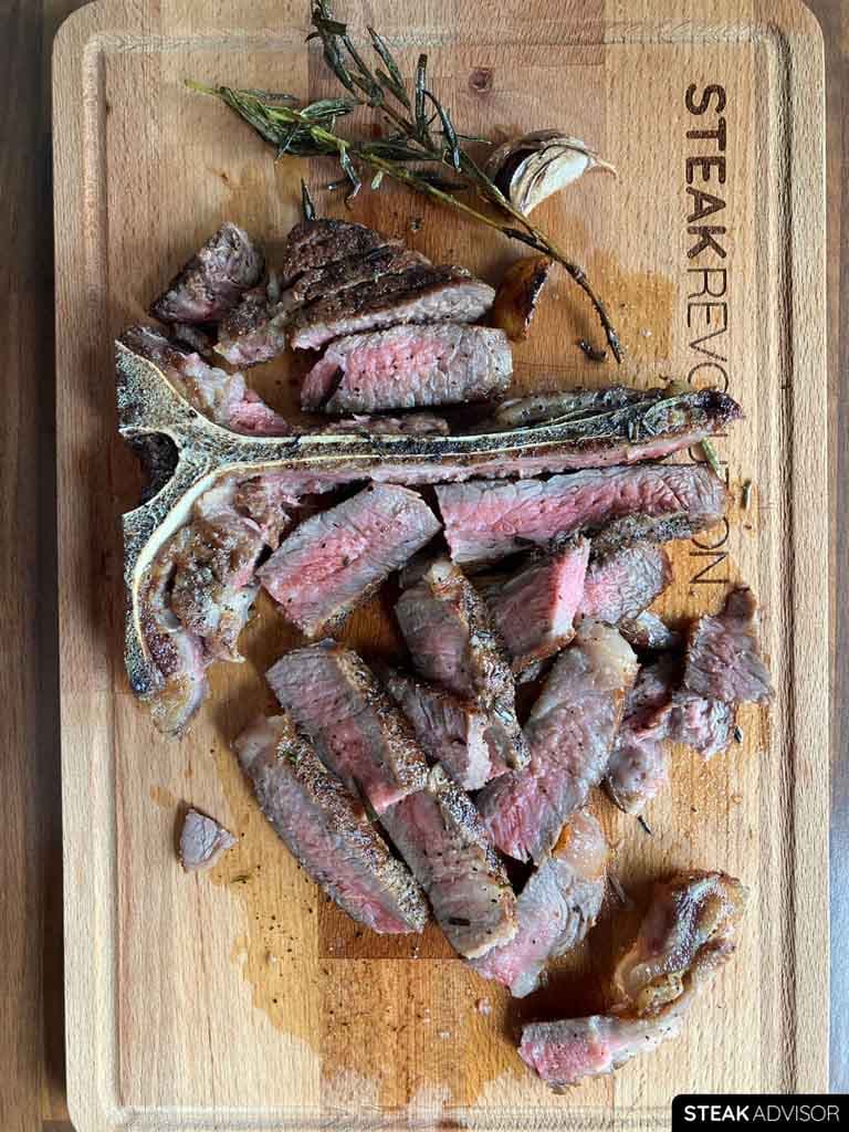 pan-seared t-bone steak; medium-rare doneness, vertical view
