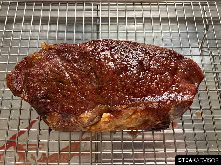 Perfectly cooked dry-aged steak with a golden-brown crust.
