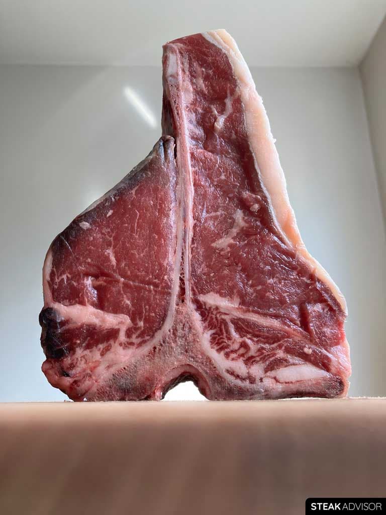 Raw porterhouse steak closer look