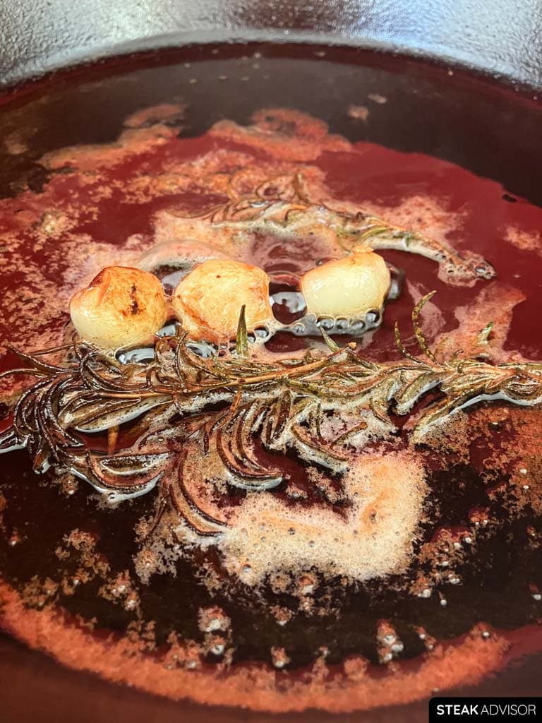 Steak aromatics such as garlic, herbs, and butter