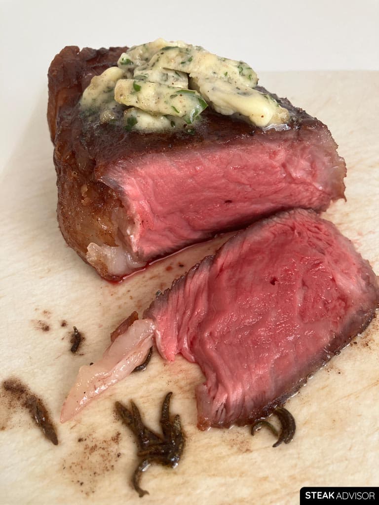Steak finished with a rich compound butter on top